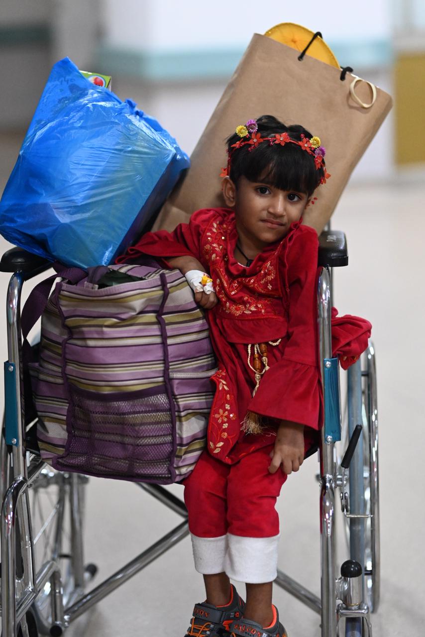 Girl in wheelchair smiling, CCCF Pakistan